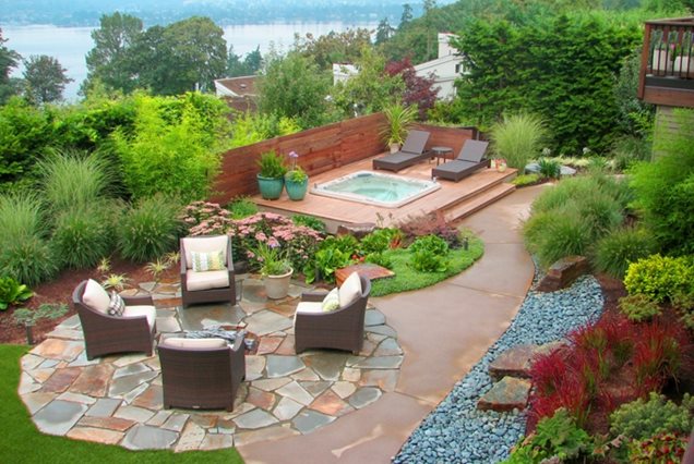 Different paving materials designate distinct areas in this backyard 