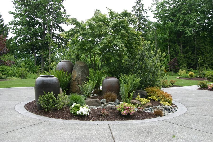 Driveway Landscaping Network, Circular Planters Around Trees